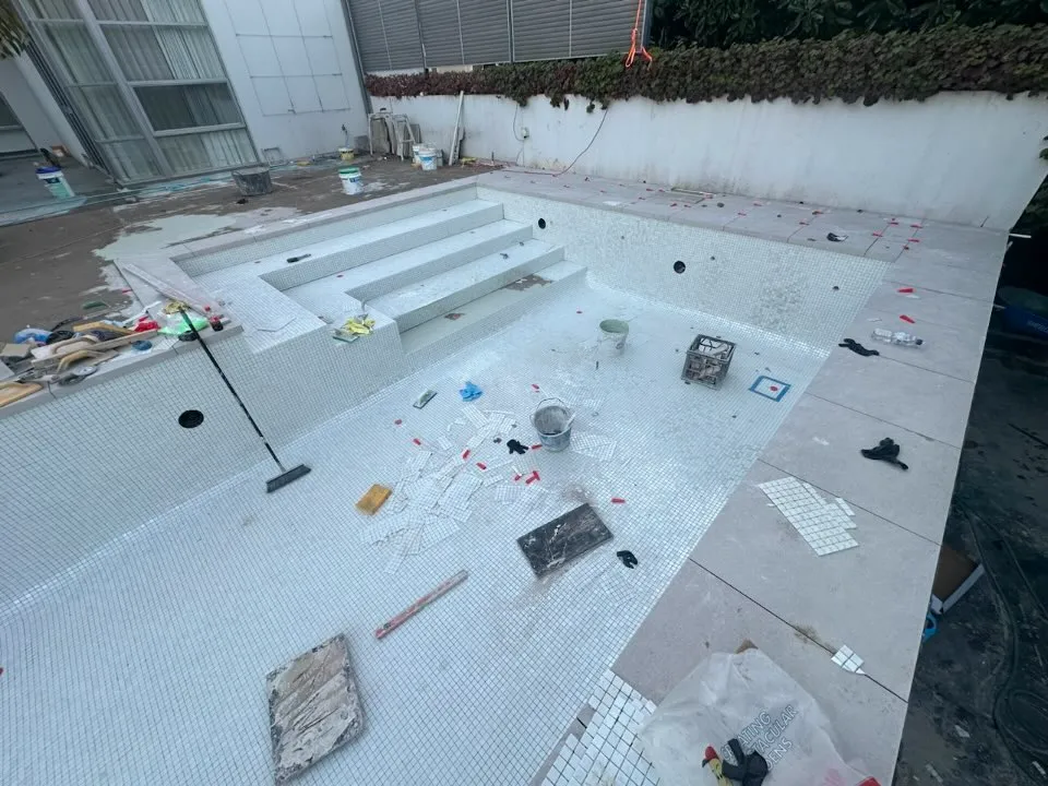 mosaic tiled concrete pool in forrest 1