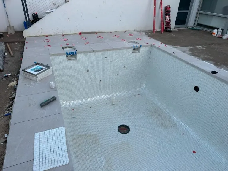 mosaic tiled concrete pool in forrest 5